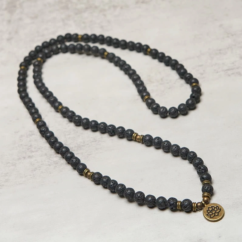 Full length lava rock mala beads necklace looped display with bronze lotus charm pendant