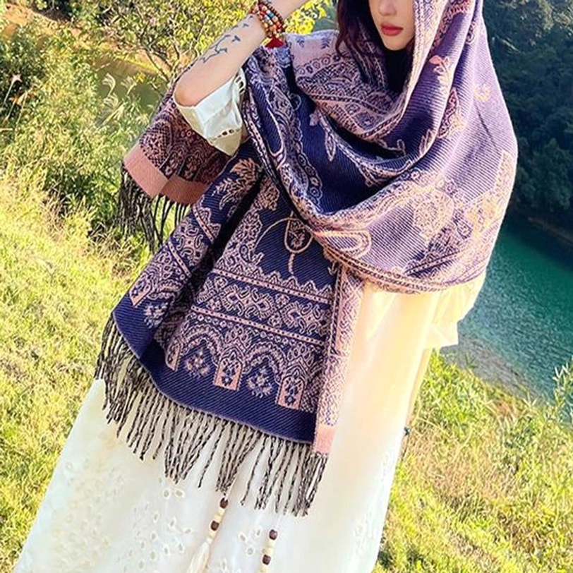 Tibetan botanical shawl worn casually over sweater showing layering versatility
