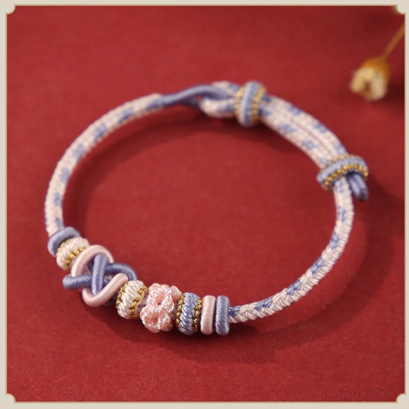 Light purple tibetan peace knot bracelet representing spiritual awakening and transformation with handwoven sacred knot