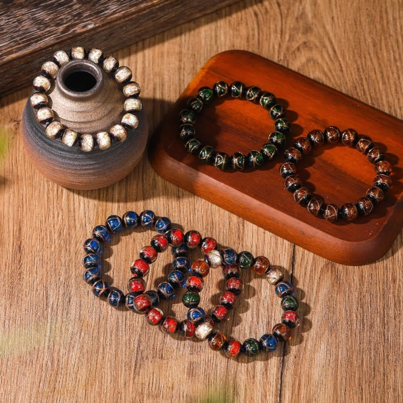 Tibetan liuli glass bead bracelet detail shot showcasing artisan craftsmanship, natural material quality, and authentic handmade variations in colored glaze beads