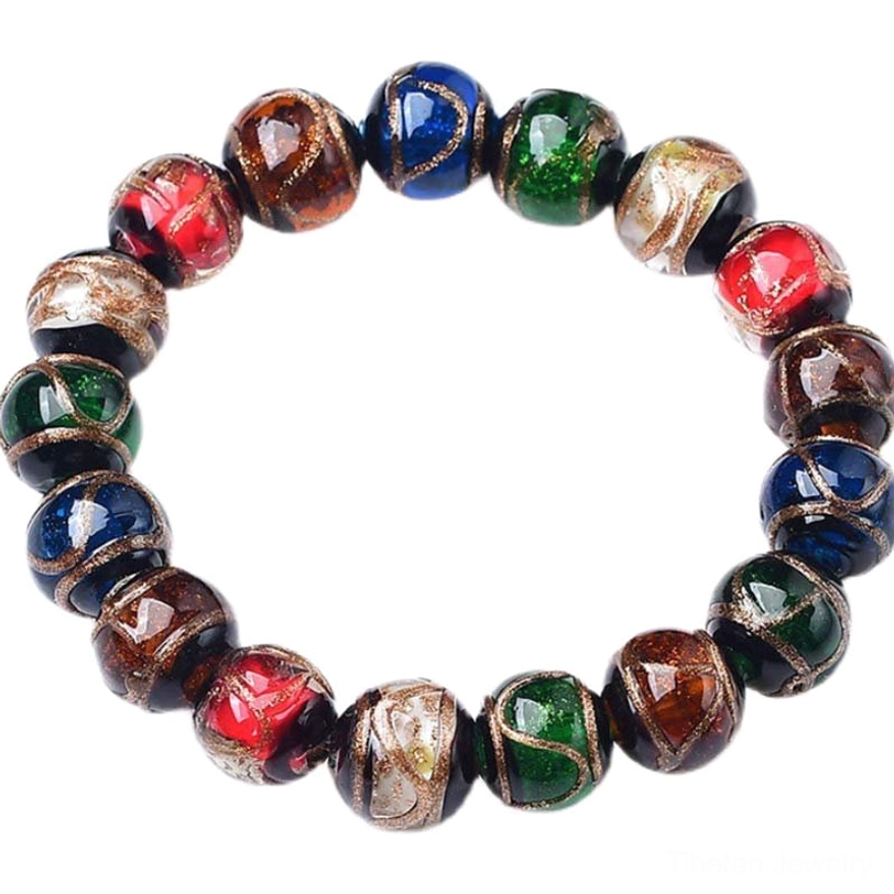 Tibetan protective colored glaze bracelet overhead frontal view showing complete circular multicolor beaded design on dark blue backdrop