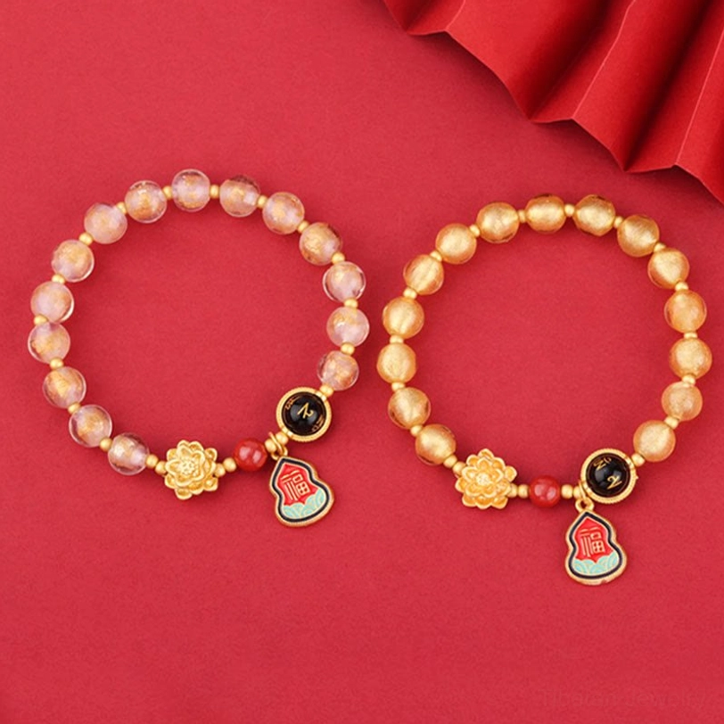 Handmade Tibetan Liuli glass prayer bracelet with multiple color variations and spiritual charm accents