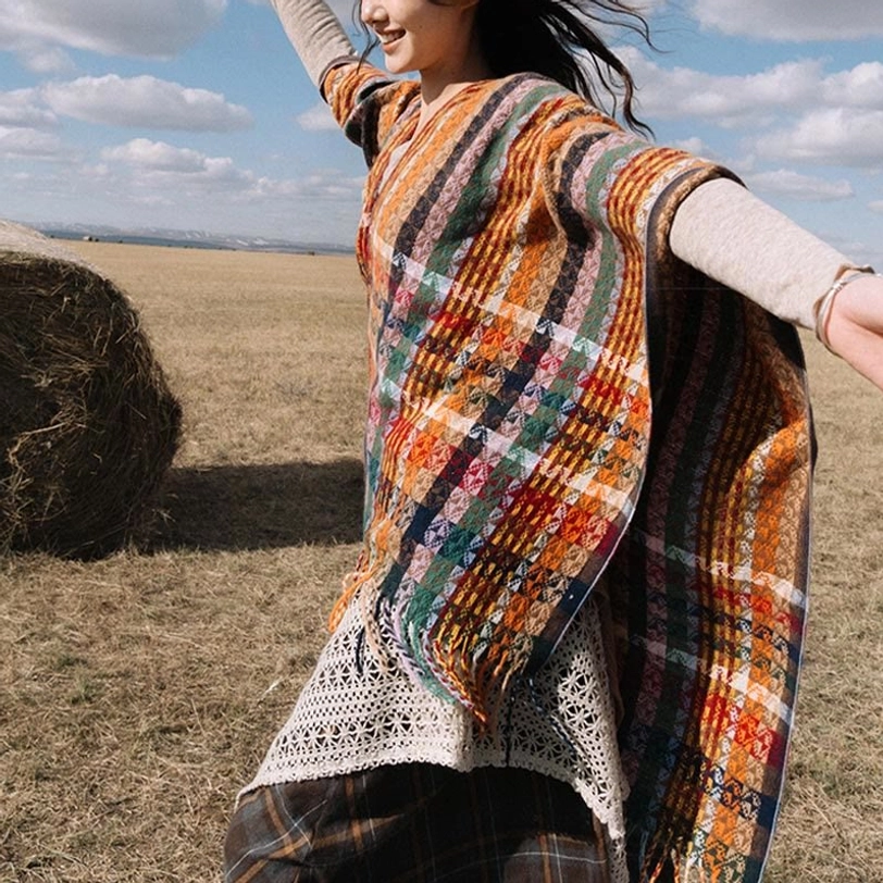 Loose Tibetan wrap shawl with mixed plaid and stripe patterns showing wide drape fit and fluttering fringed hem