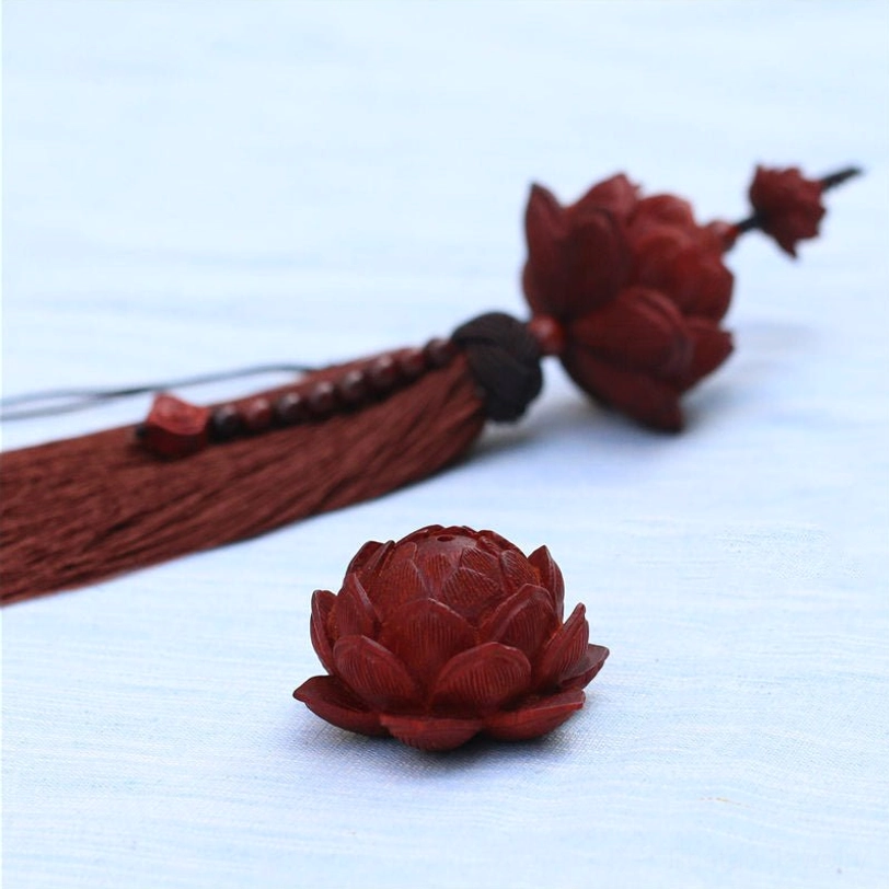 Adjustable red sandalwood lotus tassel bracelet in deep red color for men and women unisex wear