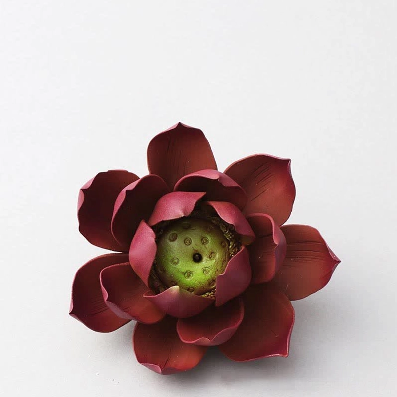 Multiple Tibetan lotus incense burners in varying clay tones displaying natural color variations from handmade production