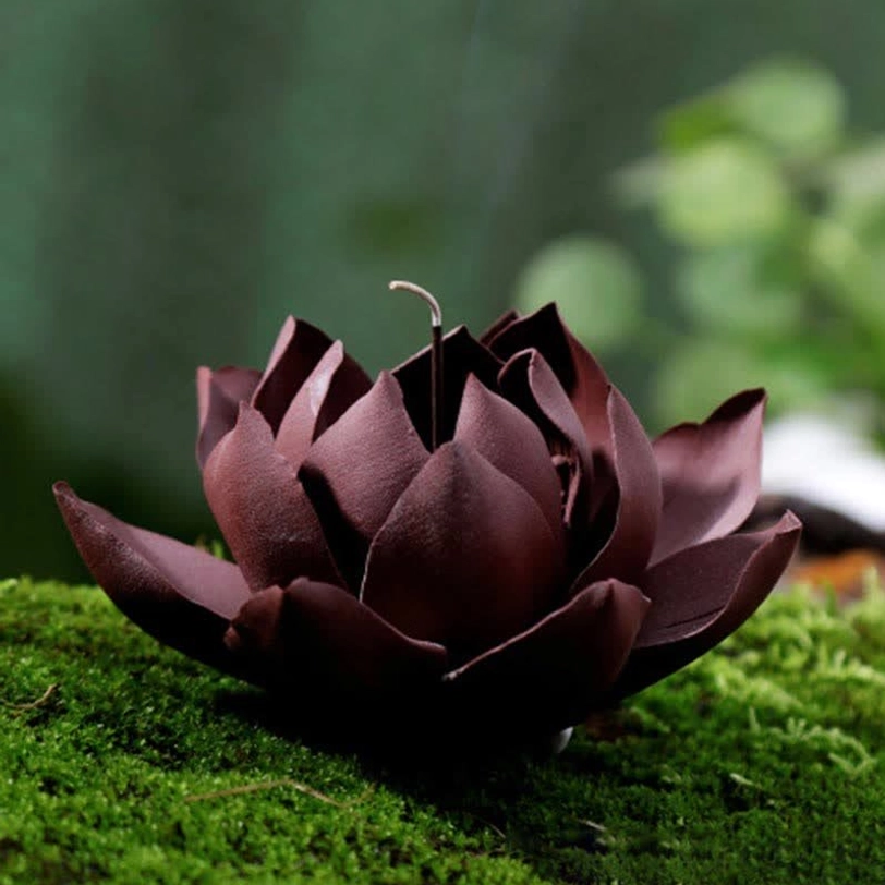 Reddish-brown lotus clay incense burner front three-quarter view on tea table setting with smoking incense cone