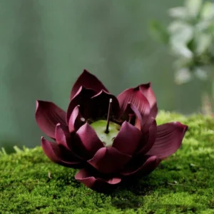Tibetan lotus incense holder three-quarter view showing dark wine red clay and green lotus seed pod cavity interior design
