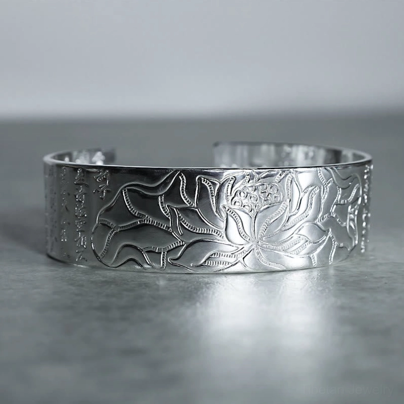 Black engraving Tibetan lotus copper bracelet with contrasting dark sutra text and lotus pattern detail, handmade artisan work