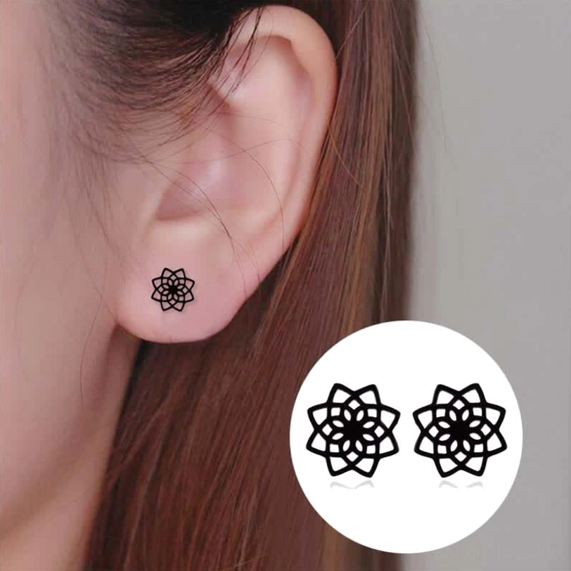 Black tibetan lotus stud earrings worn on earlobe close-up wearing effect demonstration