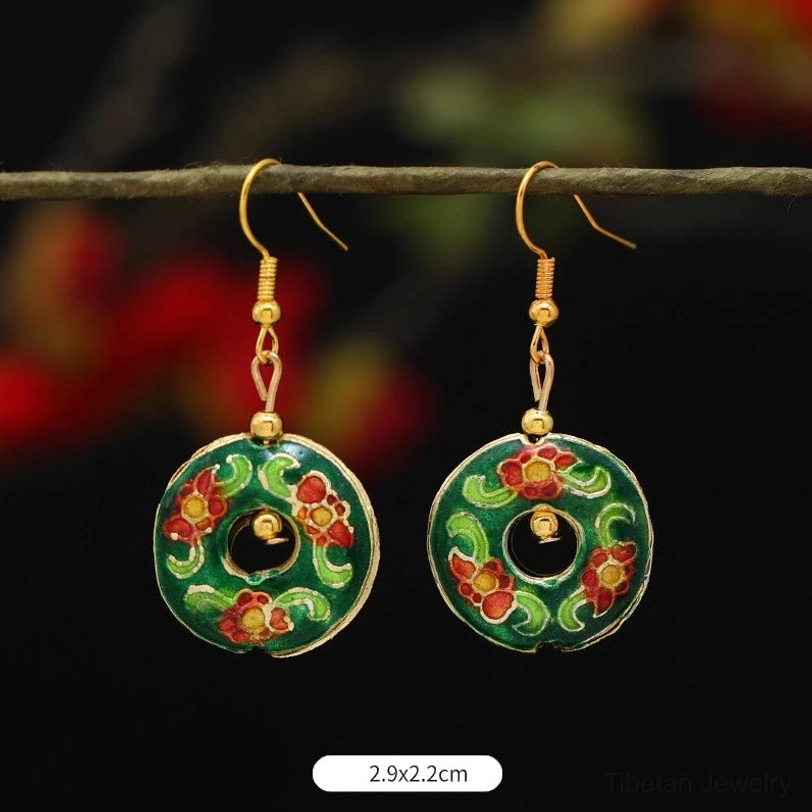 Handmade Tibetan lotus flower enamel earrings close-up showing enamel detail, artisan quality, and gold tone finishing