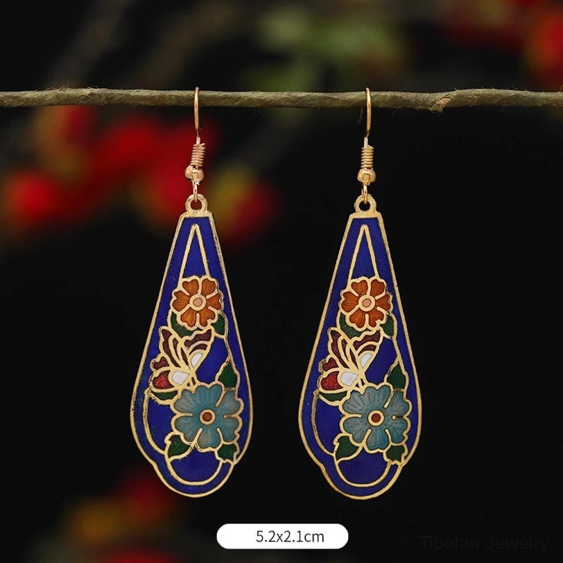 Tibetan lotus butterfly enamel drop earrings collection detail shot showing craftsmanship and enamel texture quality