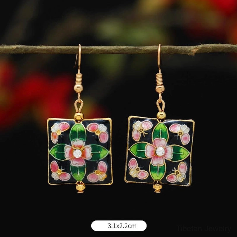 Handcrafted Tibetan lotus enamel drop earrings showing natural variations, authentic artisan handmade jewelry