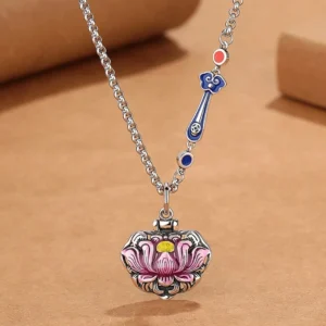Blue and pink enamel lotus necklace flat lay showing detailed enamel work and cloud accents