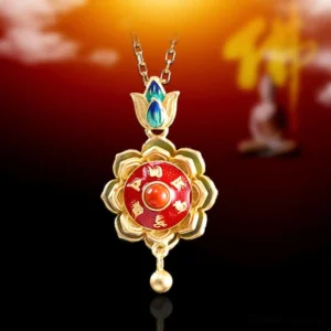 Sterling silver lotus prayer wheel pendant necklace featuring red enamel center and cloisonné blue-green lotus bail, zen-themed studio photography