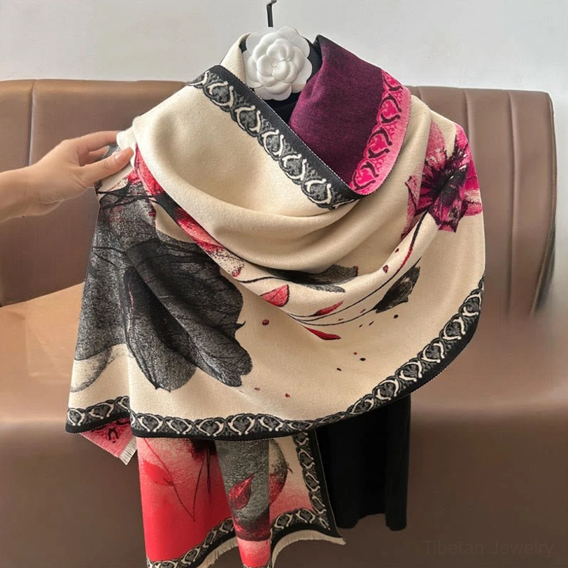 Multi-color lotus scarf in purple-pink-black held flat showing dual geometric borders and frayed hem details