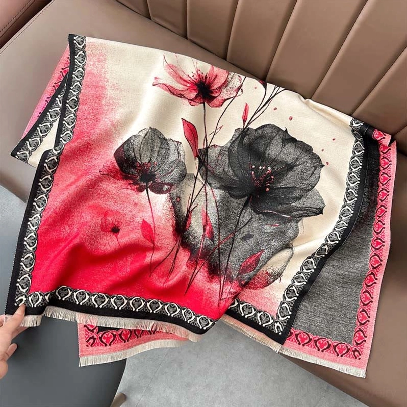 Red-toned lotus ink painting scarf with black-red watercolor blooms and pink-black gradient border flat lay close-up