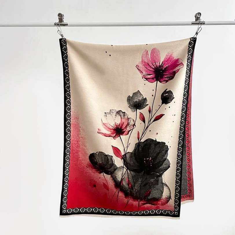 Red ink lotus watercolor scarf with beige base hanging on metal rod showing black geometric border and artistic pattern