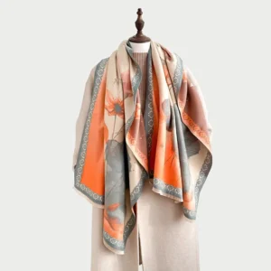 Tibetan lotus ink painting scarf in sandy brown displayed on mannequin with embroidered geometric border and frayed edges