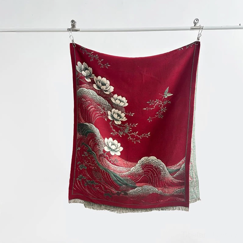 Deep red Tibetan tassel shawl with white lotus and wave patterns hanging display