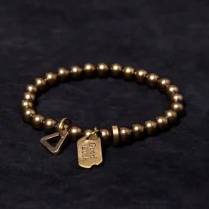 Vintage style tibetan copper beaded bracelet with polished brass beads and spiritual charm details