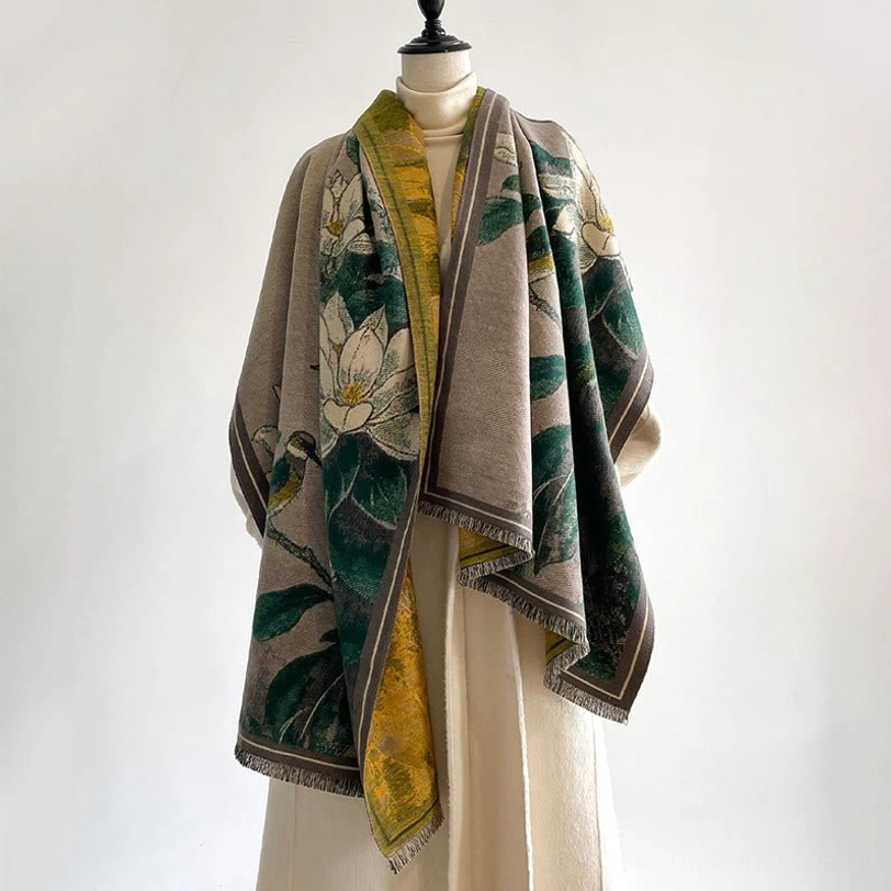 Tibetan scarf with green magnolia pattern and yellow lining worn on model - side view showing texture