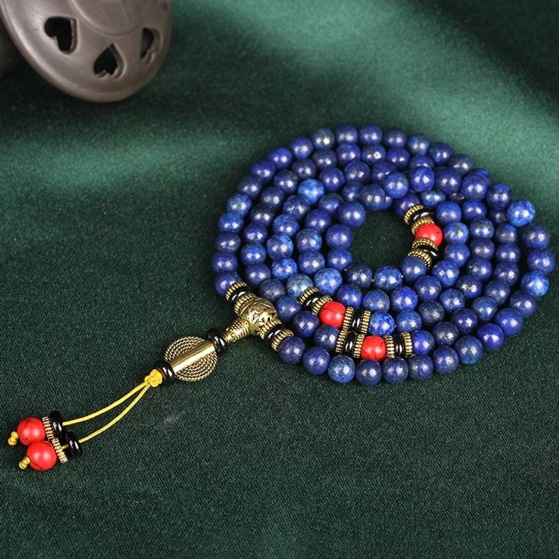 Full-length lapis lazuli 108 bead mala prayer beads looped display with bronze and red decorative accessories