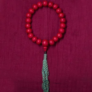 Circular tibetan prayer bead mala flat lay overhead view natural wood beads matching tassel
