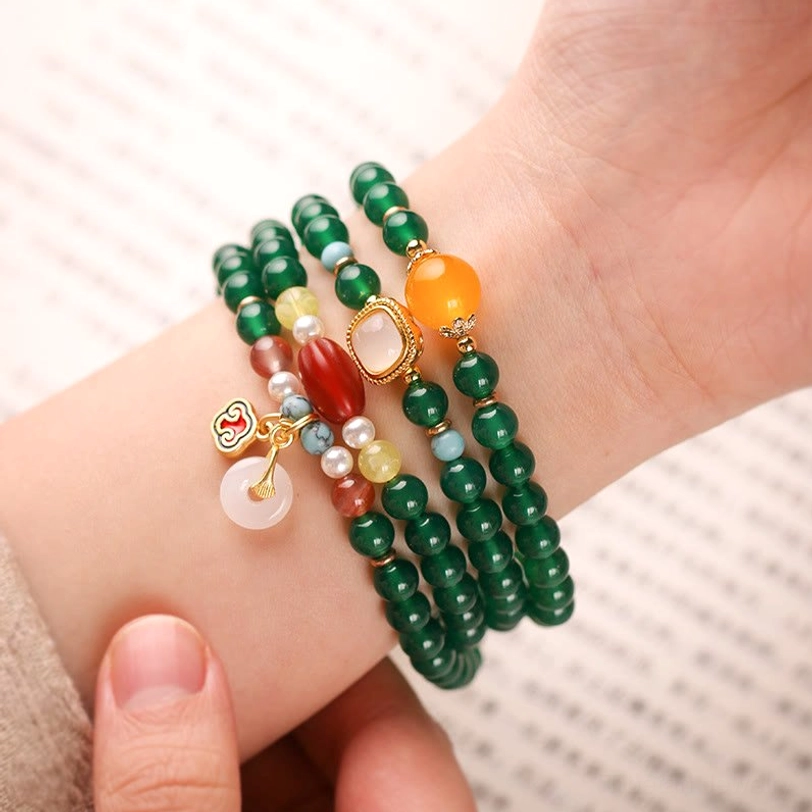 Tibetan mala bracelet with green agate stones and multicolor gemstone accent beads