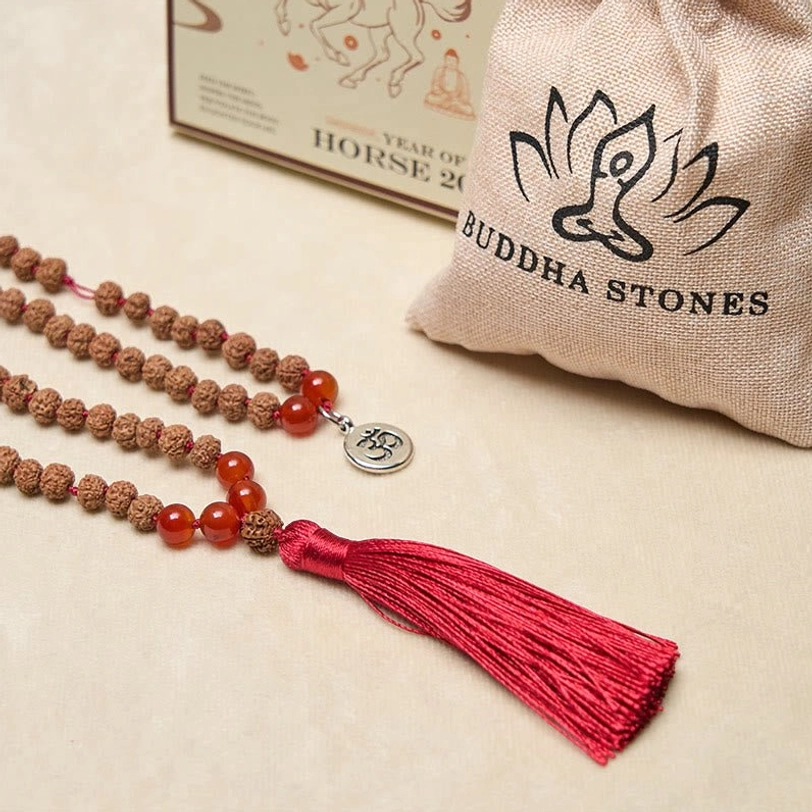 Tibetan 108 bead mala necklace with Om charm, red tassel, and branded storage pouch