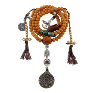 Complete Tibetan prayer mala set with bodhi seeds, red tassel, OM charm, mixed stone metal decorations, and Bagua pendant on white background
