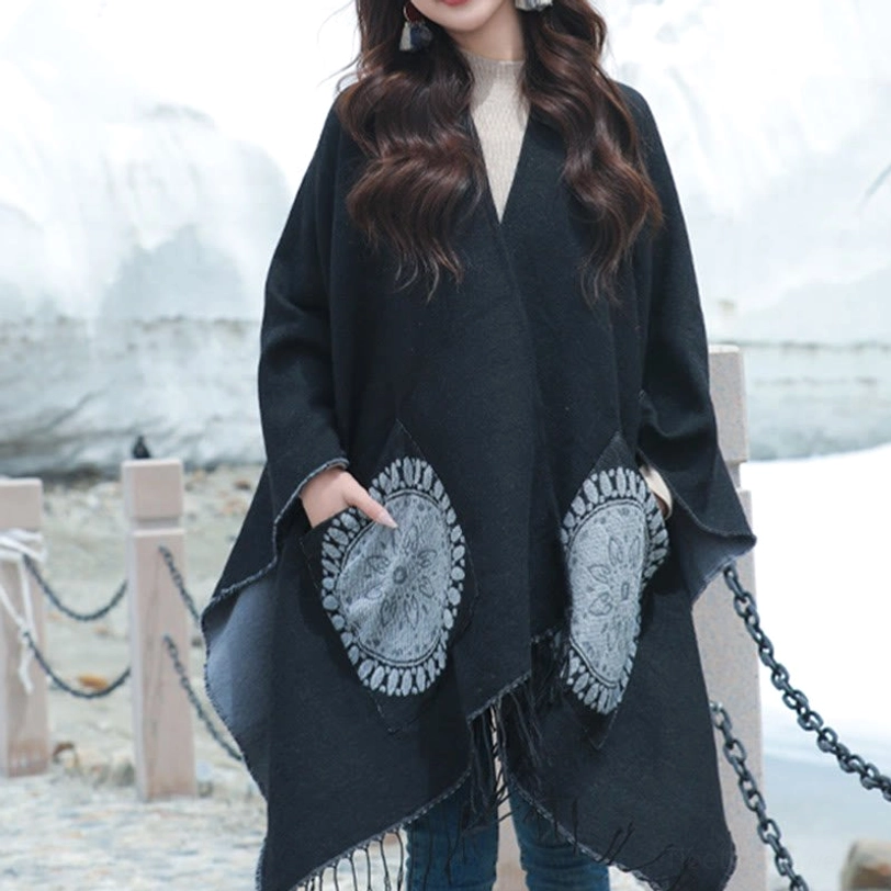 Black Tibetan mandala wrap shawl with grey geometric patches and side pockets, lakeside outdoor