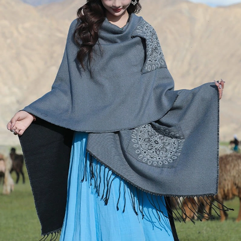 Gray mandala wrap shawl with blue geometric patches, front view