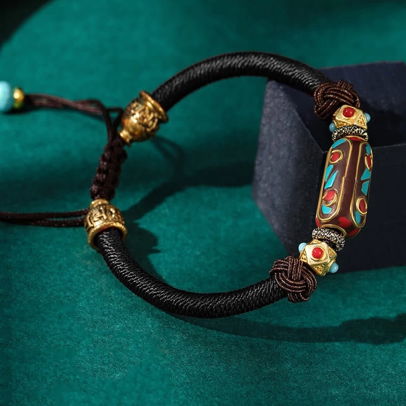Black Tibetan Om Mani Padme Hum braided bracelet variant with natural turquoise beads and gold copper metal accents