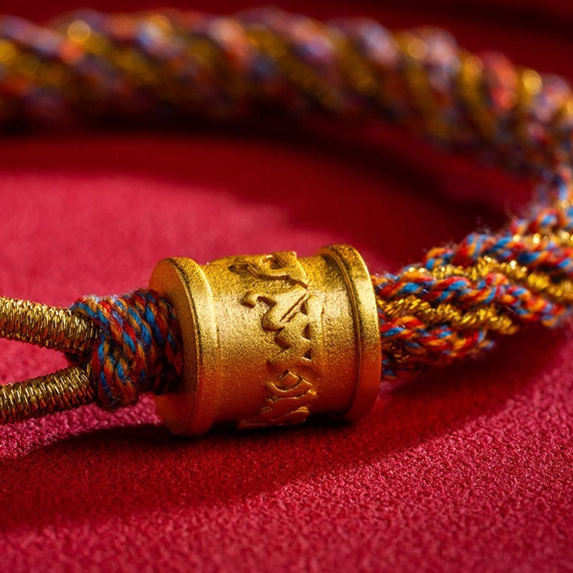 Carved Tibetan copper tube bead with Buddhist mantra inscription and multicolor twisted rope