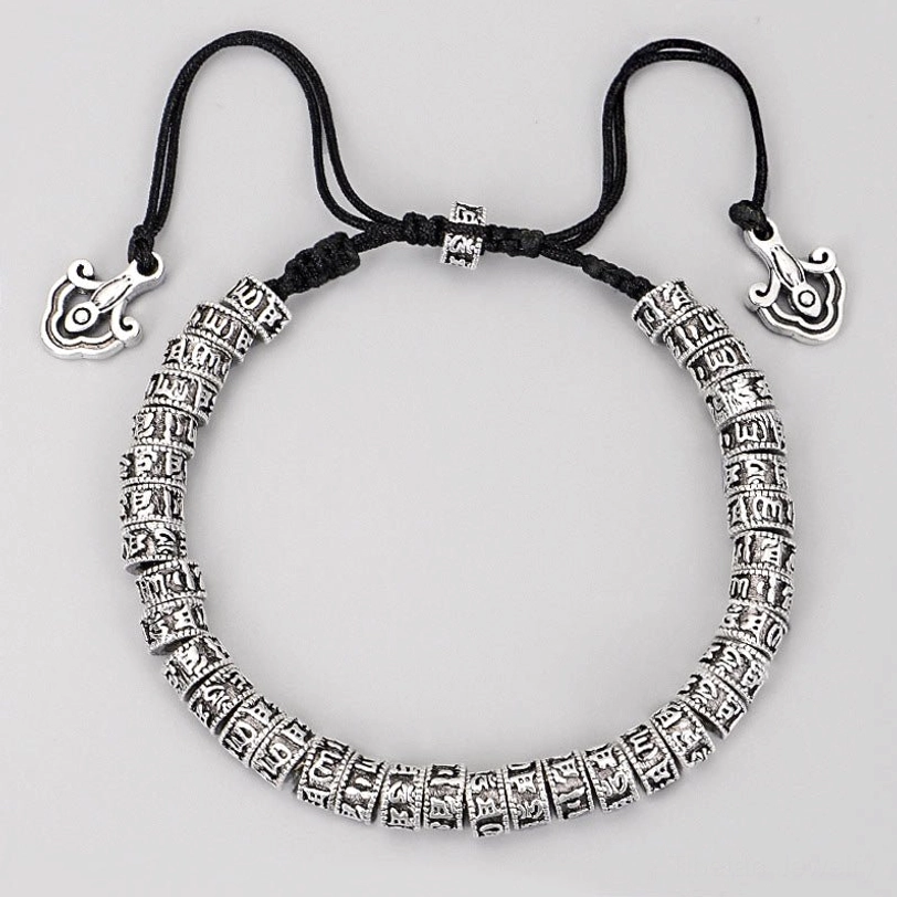 Tibetan mantra bracelet front view displaying engraved alloy silver beads with cloud-shaped charm pendant and adjustable black cord