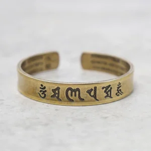 Tibetan Om Mani Padme Hum mantra brass bracelet front view with engraved six-word mantra