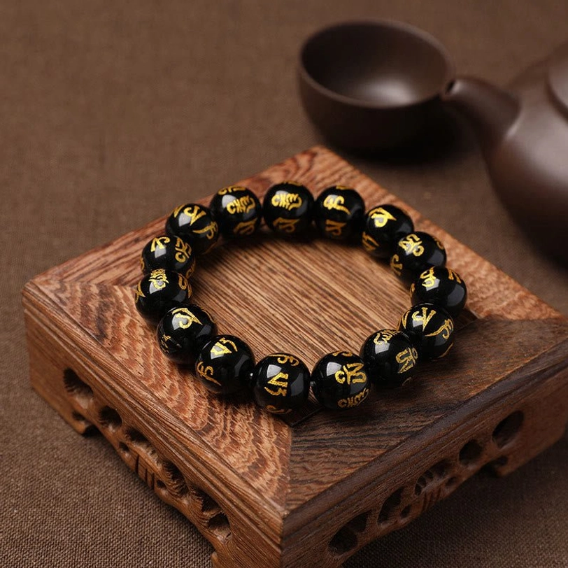Tibetan mantra meditation bracelet with synthetic crystal beads handcrafted by skilled artisans