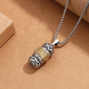 Side oblique view of carved Tibetan Om Mani Padme Hum pendant showing rotatable engraved central band with vintage retro finish