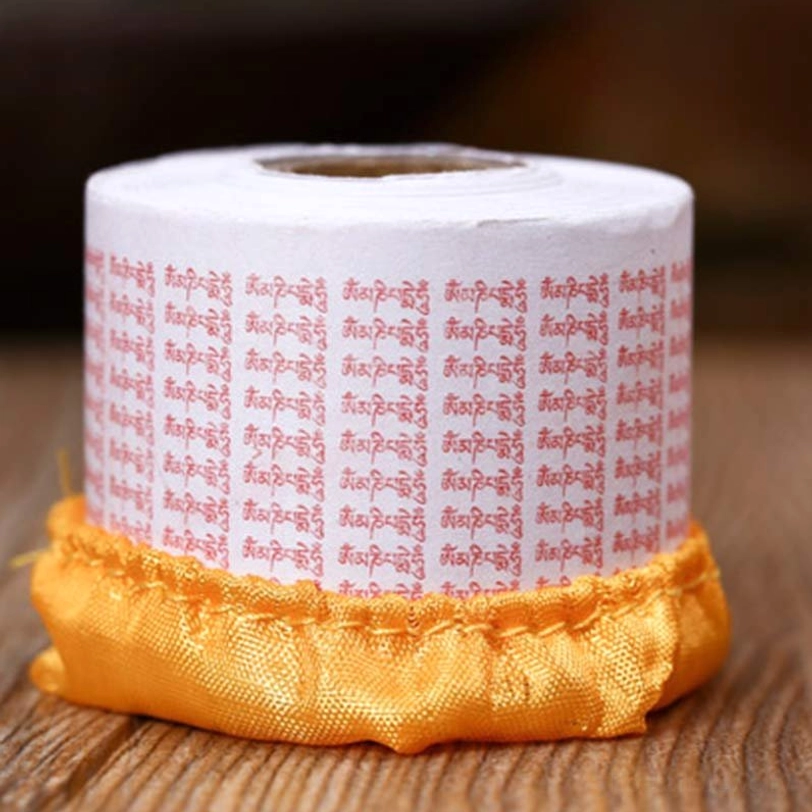Buddhist mantra paper roll with red sanskrit om mani padme hum prints on white paper traditional format