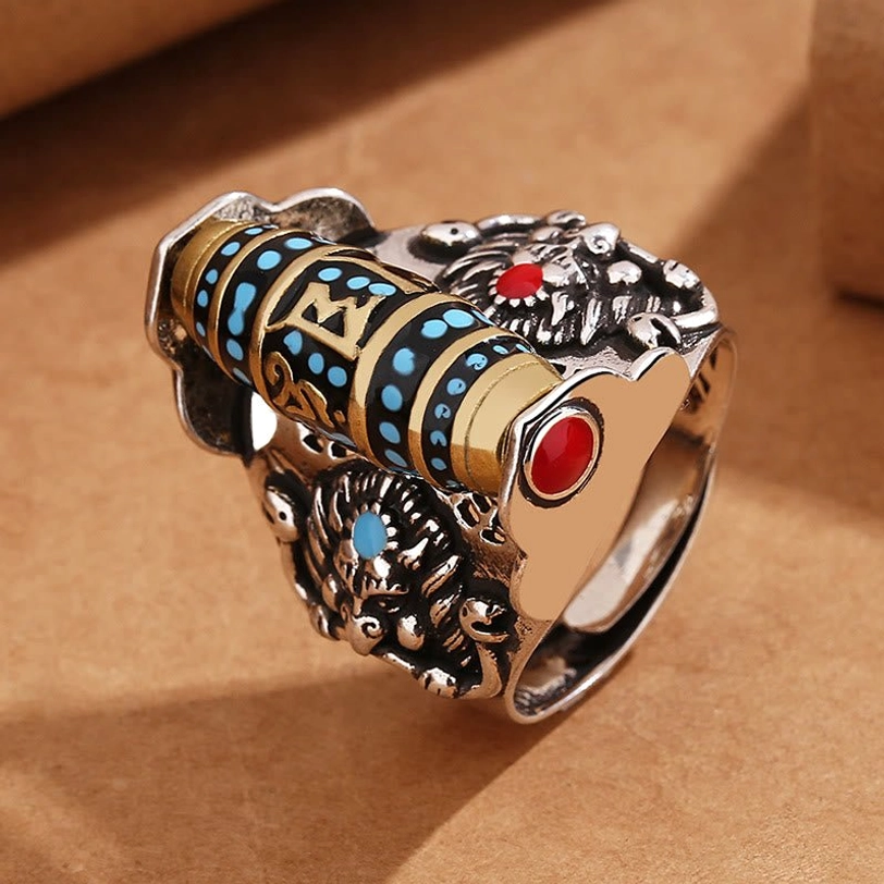 Handmade Tibetan Om Mani Padme Hum rotating ring with mixed gold-silver finish, Sanskrit mantras on rotating bead, three-quarter angle