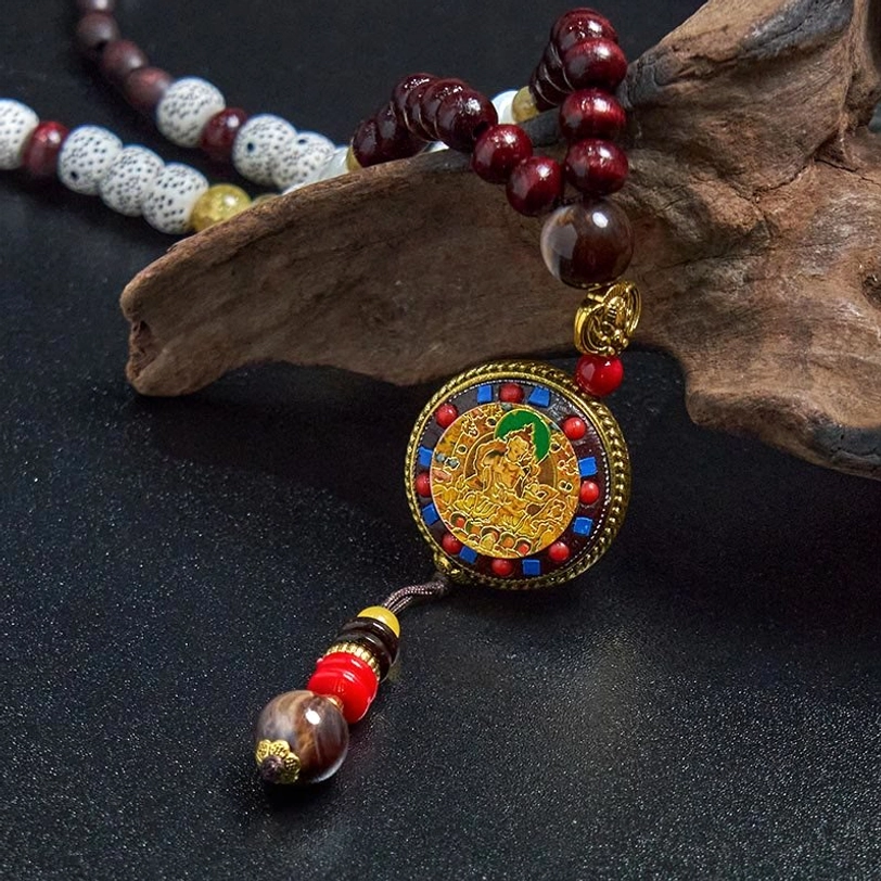 Tibetan wood bead necklace with mixed material beads and spiritual pendant detail