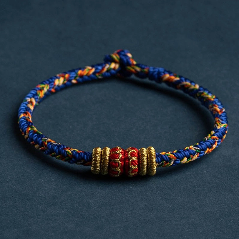 Blue and multicolor mixed Tibetan braided luck bracelet with gold-red decorative knots