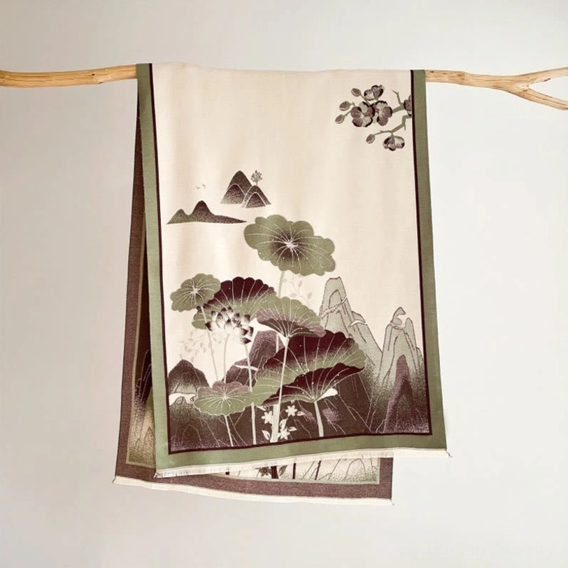 Handcrafted Tibetan shawl with monochrome lotus landscape in indigo blue and off-white, wrapped on mannequin three-quarter view