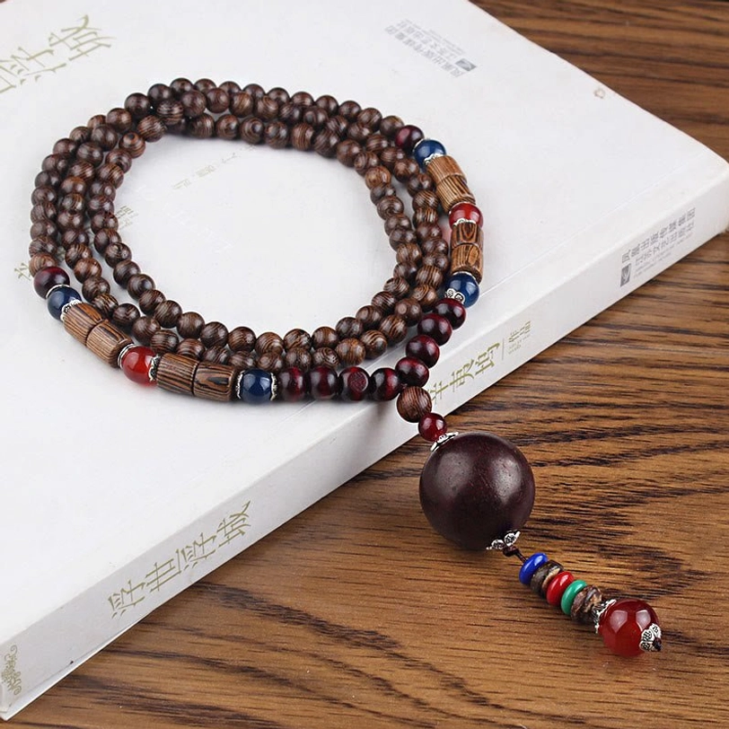Multi-loop tibetan wooden bead necklace with dark round agate pendant and colorful tassel decoration