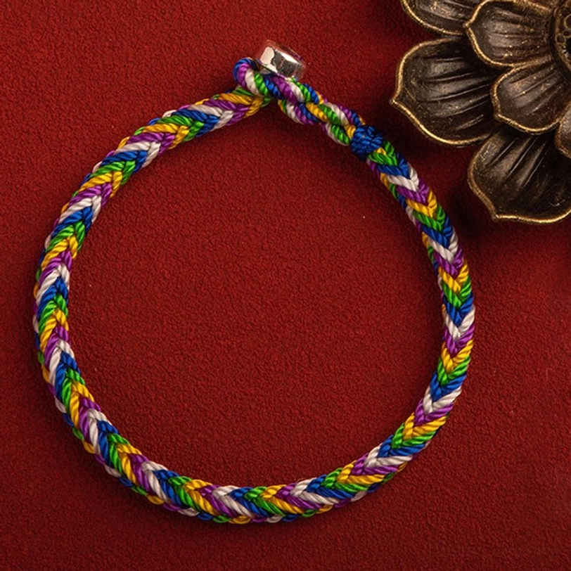 Rainbow braided Tibetan protection bracelet with silver metal clasp and bronze lotus decoration