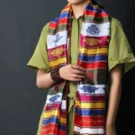 Tibetan multicolored lotus khata blessing scarf with vibrant striped embroidery displayed on model half-body front view