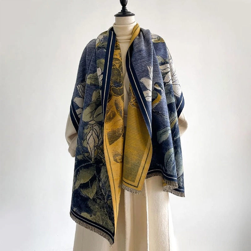 Navy blue Tibetan magnolia bird scarf worn on model - front view with yellow inner lining visible