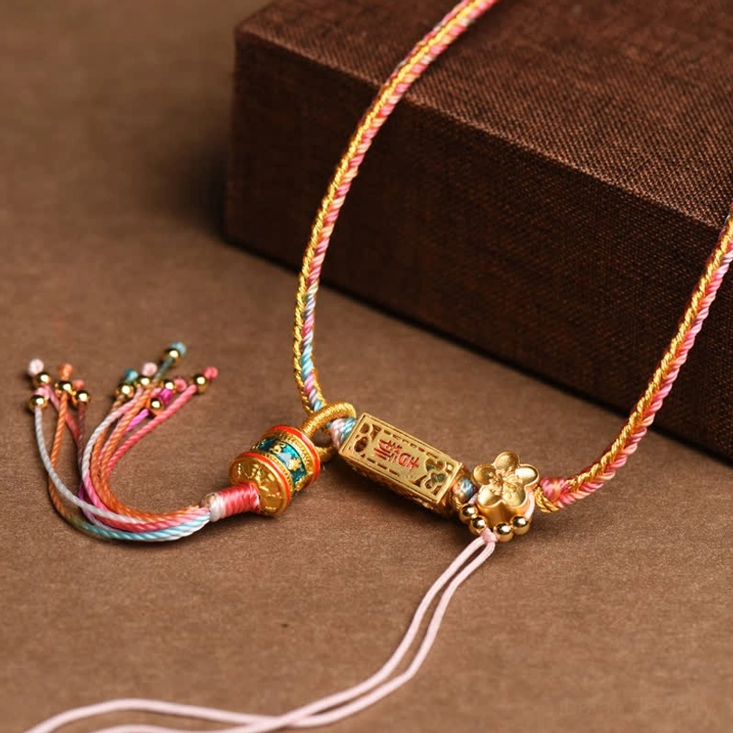 Tibetan braided copper prosperity necklace with pink-yellow rope flower-shaped gold charm and multi-color tassel
