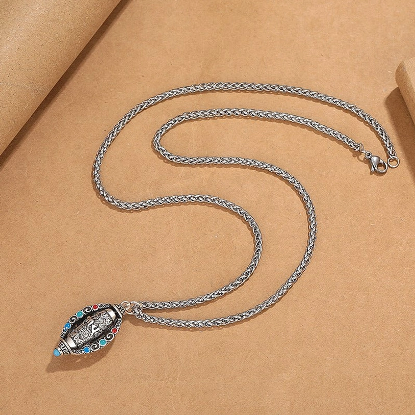 Full Tibetan Om Mani Padme Hum necklace flat lay displaying complete wheat-link stainless steel chain with compact vintage pendant