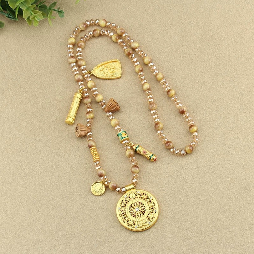 Handcrafted Tibetan necklace featuring authentic tiger eye beads and spiritual gold pendant